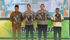 Perjanjian Kerja Sama (PKS) antara Pemkab Madiun, Bapenda Provinsi Jawa Timur, Polres Madiun, dan Polres Madiun Kota di Pendopo Mudagraha, Selasa (2/12/2025).